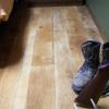 This photo features concrete flooring with a rustic wood finish.
